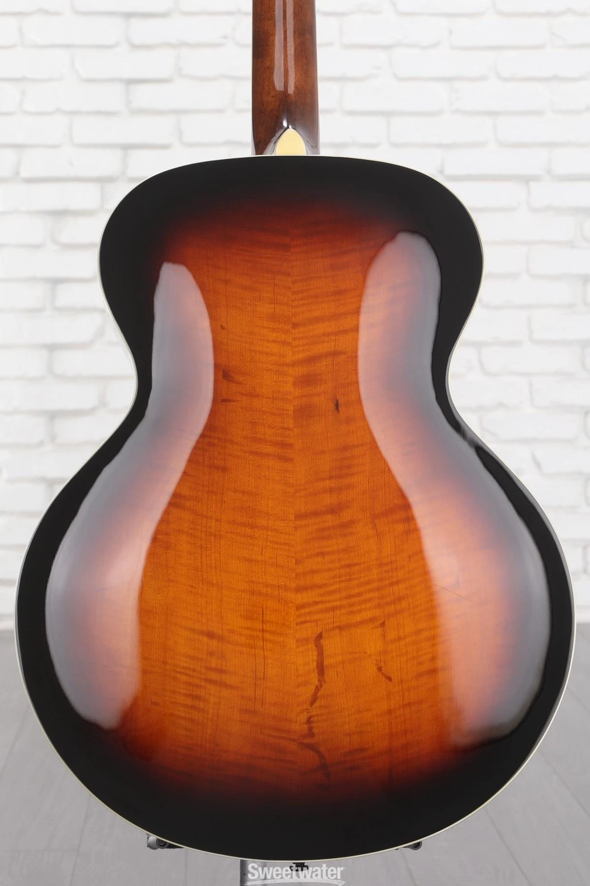 Irregular lines in figuring of wood grain in new Loar acoustic The
