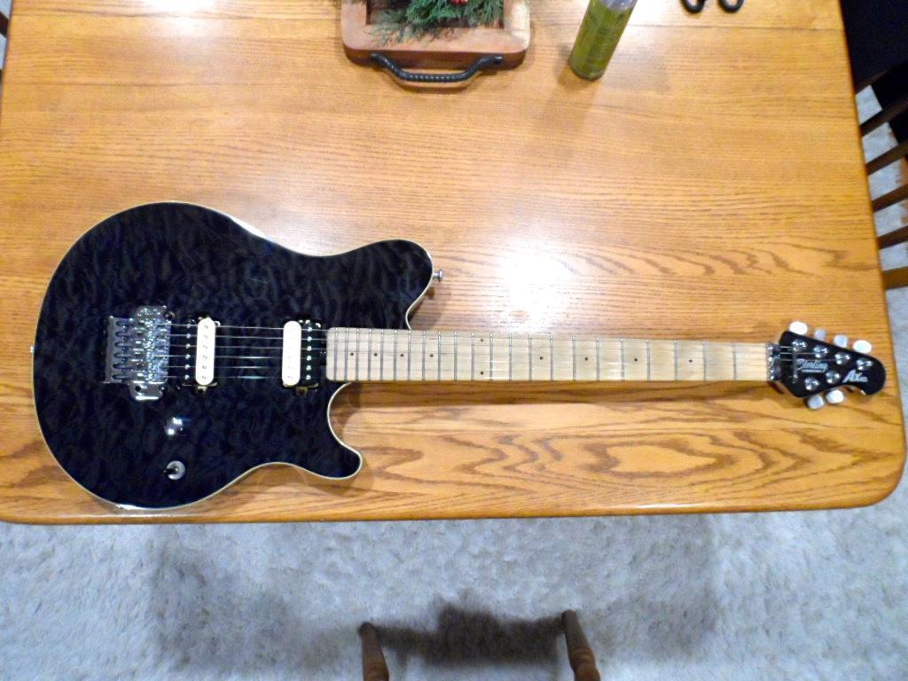 Used Sterling by Ernie Ball Music Man AX40 AX-40 by Ernie Ball Music Man  Trans Black Quilt Curly Flame Top