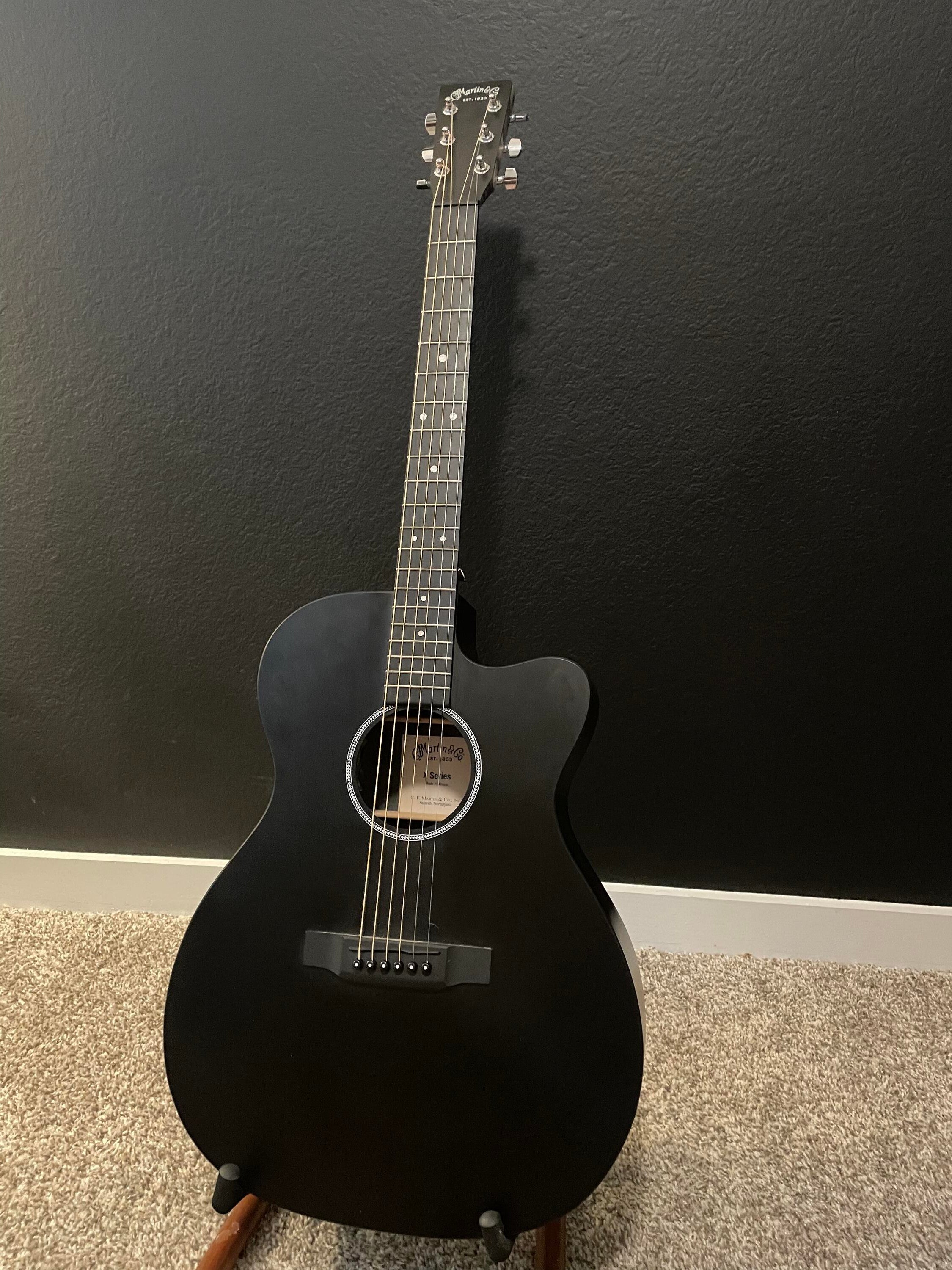 used black acoustic guitar