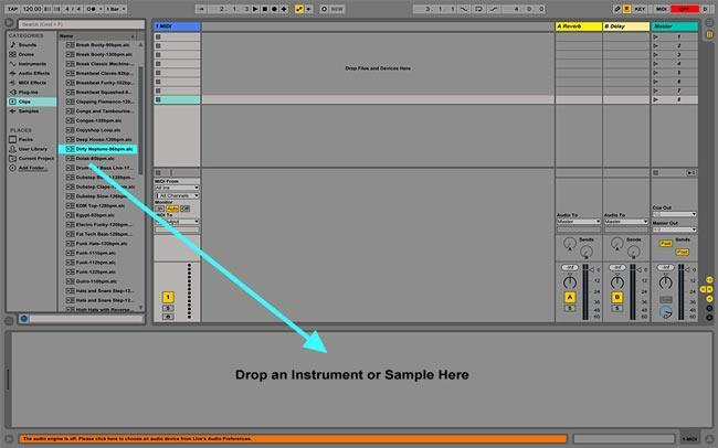 A picture of an arrow pointing to Abelton live interface bottom section that says drop an instrument of item here