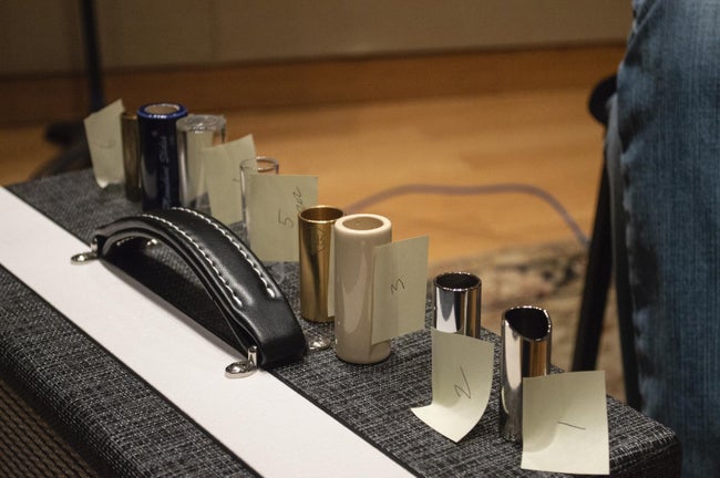 Guitar-slides-sitting-on-amplifer