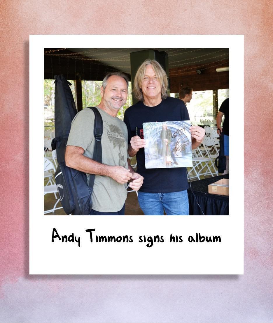 A polaroid of Andy Timmons signing his album at The Woodshed 2024.