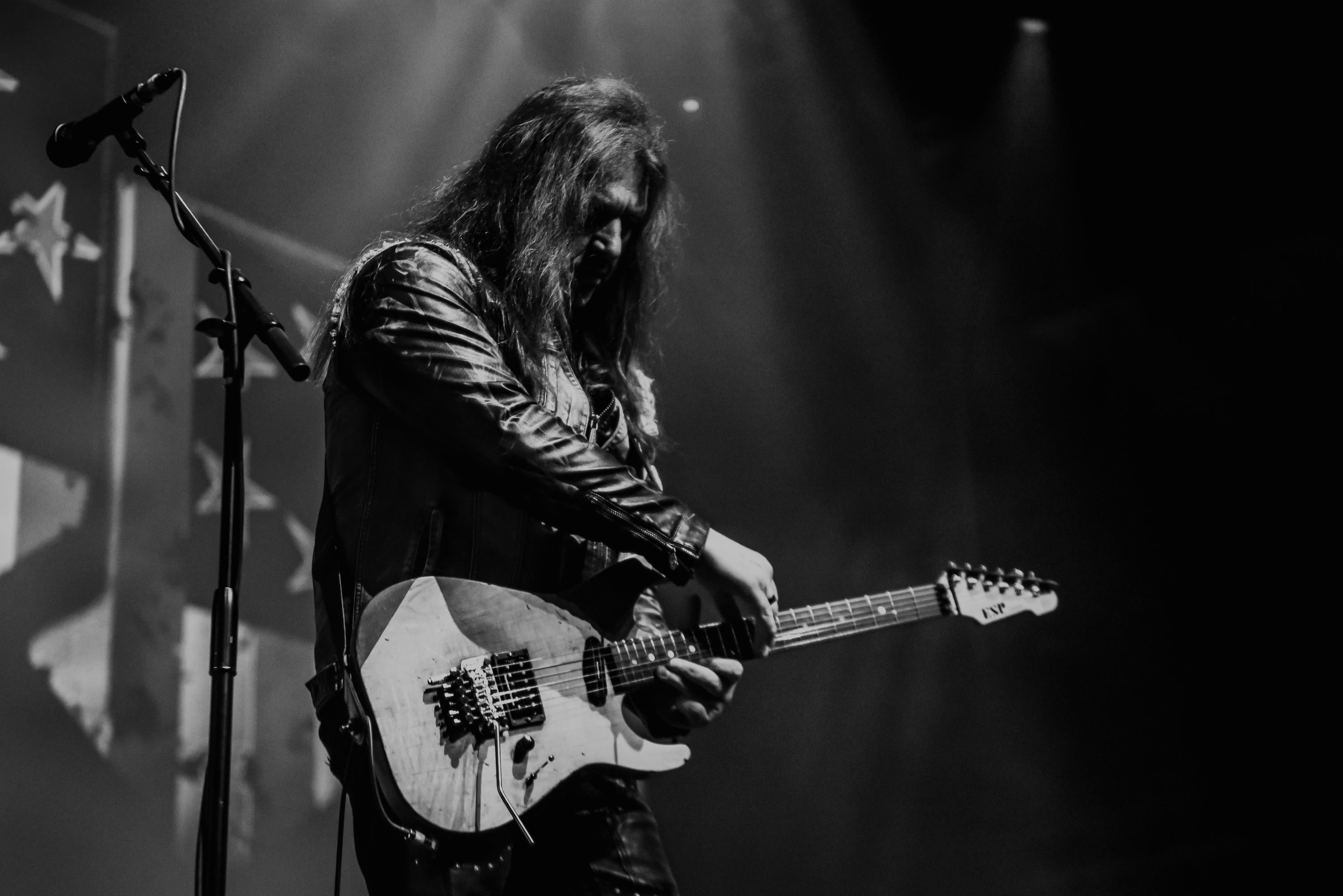 Snake Sabo playing guitar with Skid Row
