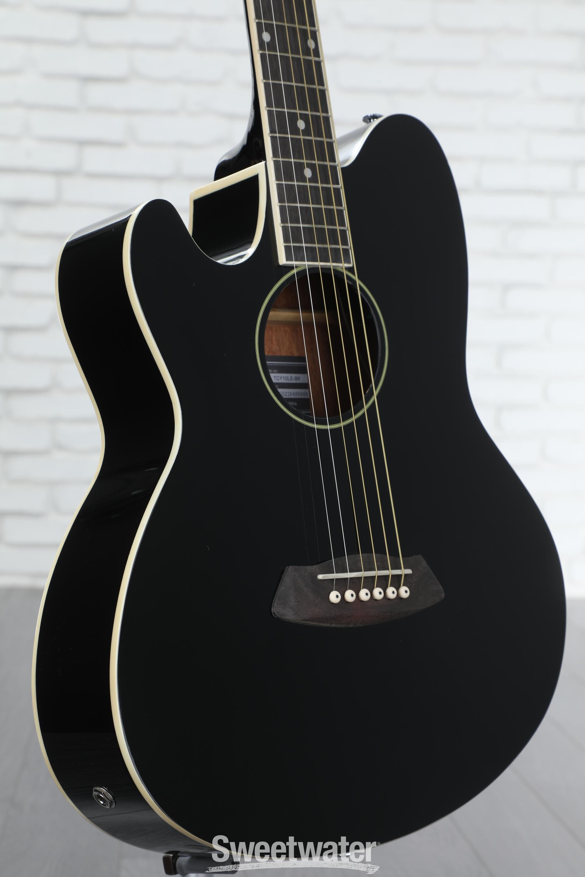 Black left deals handed acoustic guitar