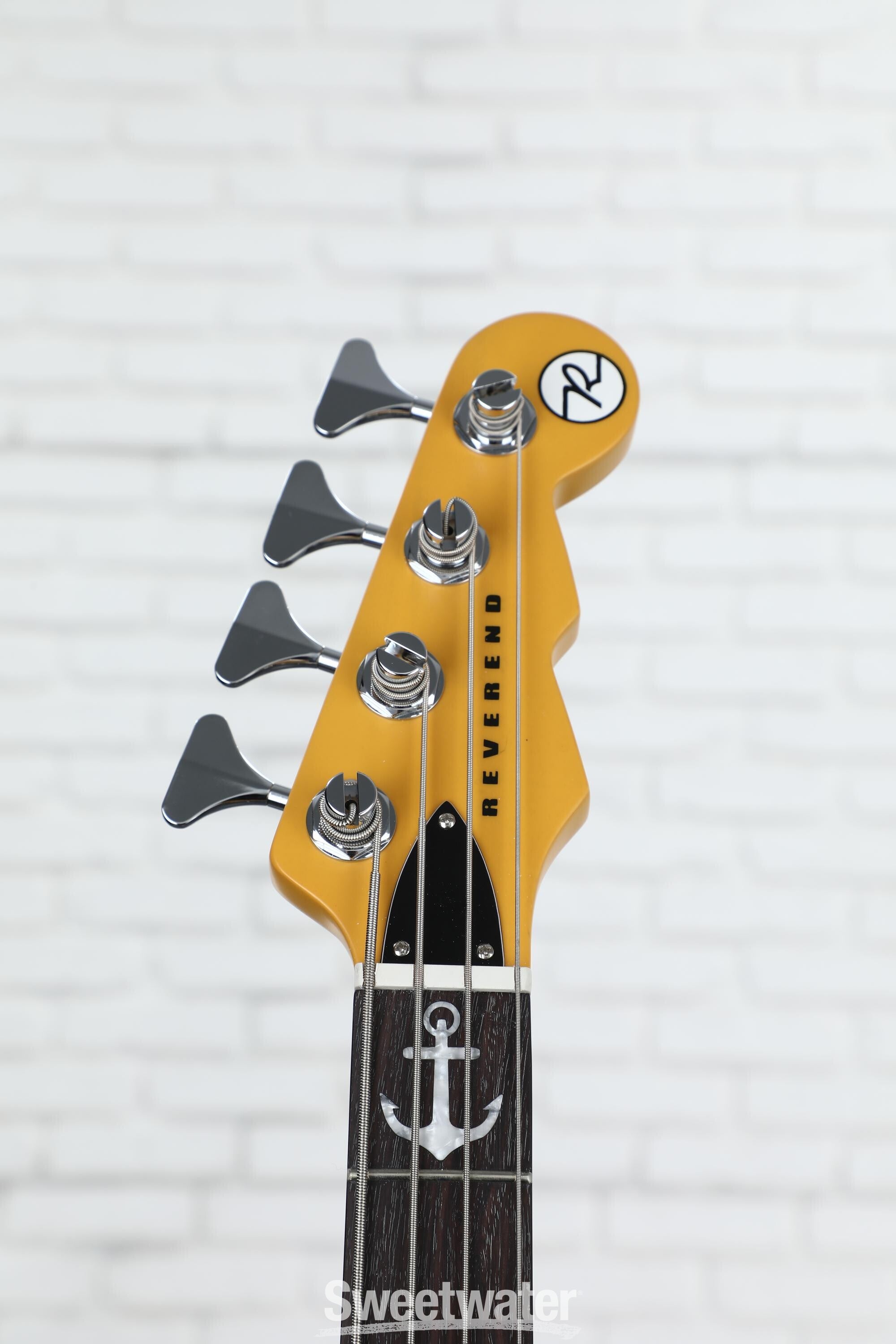 Electric guitar with a cursive b on the store headstock