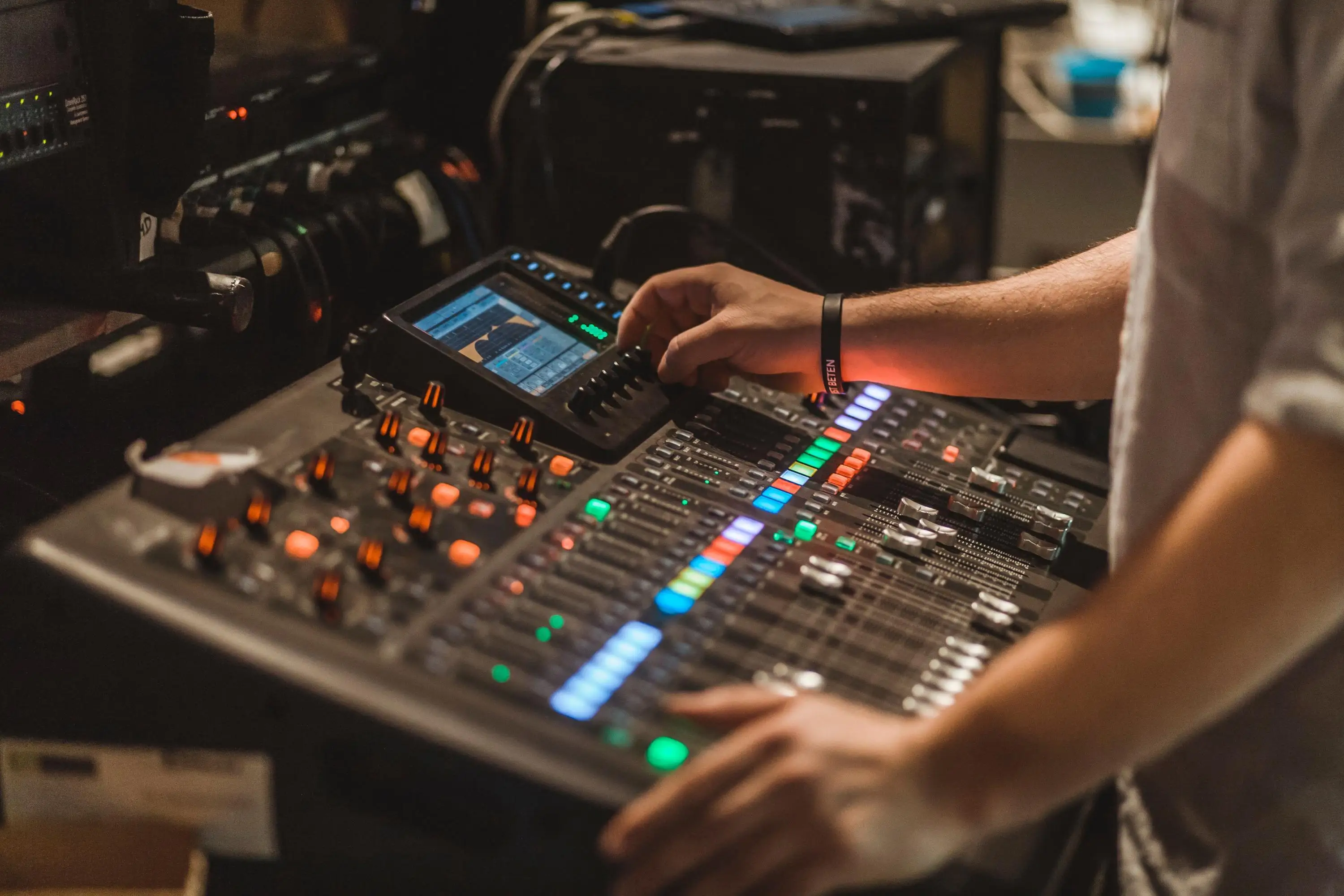 Sound engineer operating mixing board